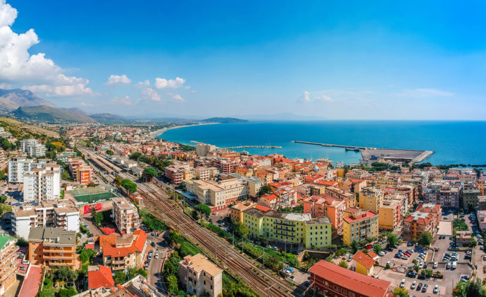 Panoramic sea landscape with Formia, Lazio, Italy. Scenic resort town village with nice sand beach and clear blue water. Famous tourist destination in Riviera de Ulisse