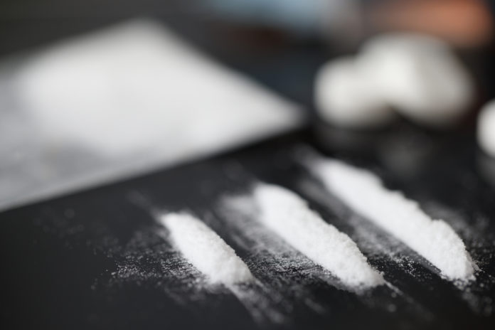 Closeup,Of,White,Narcotic,Powder,Tracks,On,Black,Background.,Opioid